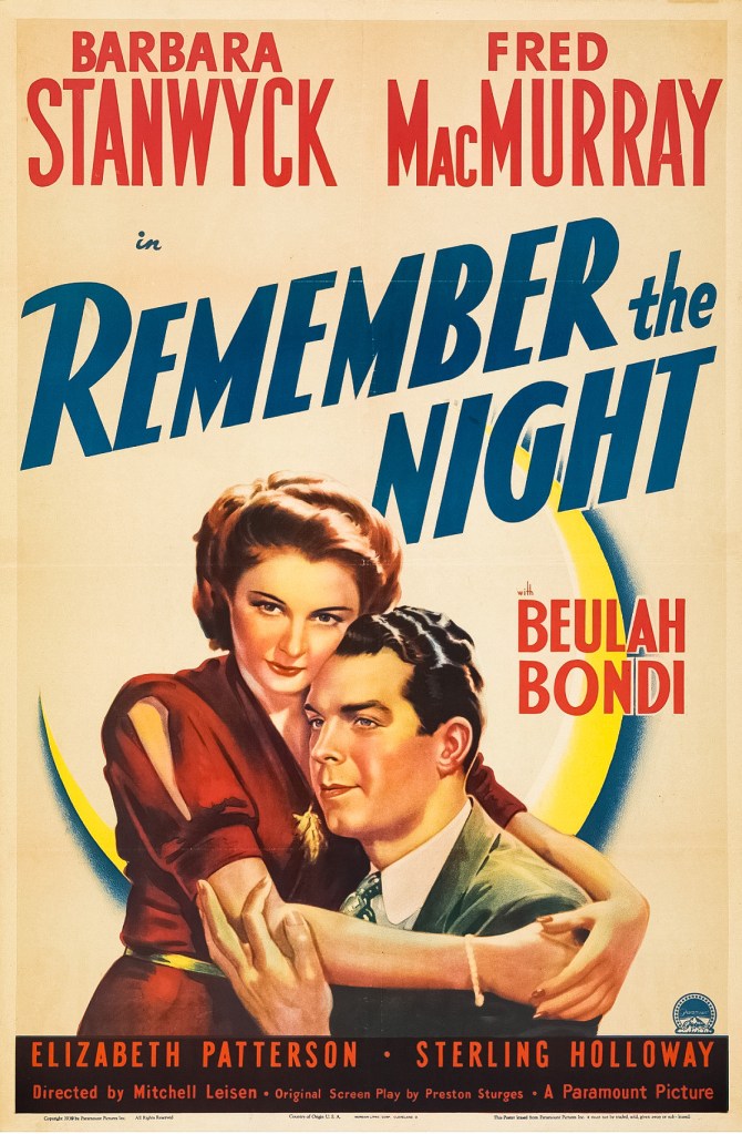 The poster for Remember the Night features Barbara Stanwyck on the right in a red dress, standing next to Fred MacMurray (who is dressed in a dark suit and tie) and placing her arms around him.